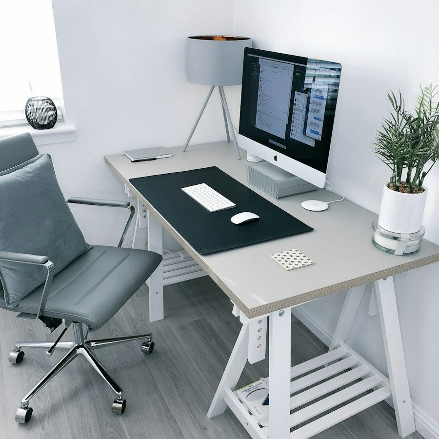 Home office furnished with wooden and upholstered furniture